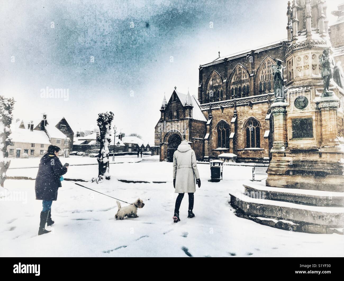UK, Weather, Sherborne, Dorset. Snow falls on Sherborne Abbey in the historic market town of Sherborne as the so called mini Beast from the East brings another icy blast to the South West. - Smartphone Captured Stock Image