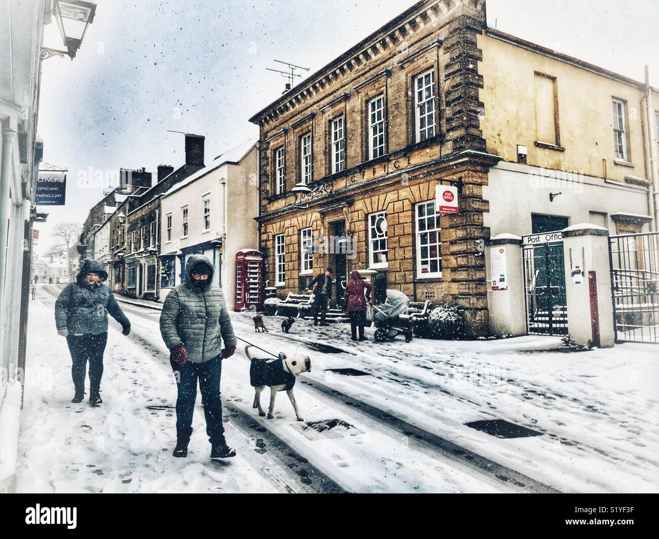 UK, Weather, Sherborne, Dorset. People walking down Cheap Street in Sherborne as the so called mini Beast from the East brings another icy blast to the South West. Stock Photo