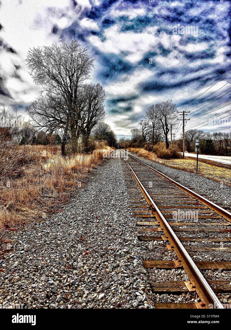 View of railroad tracks with dramatic sky - Smartphone Captured Stock Image