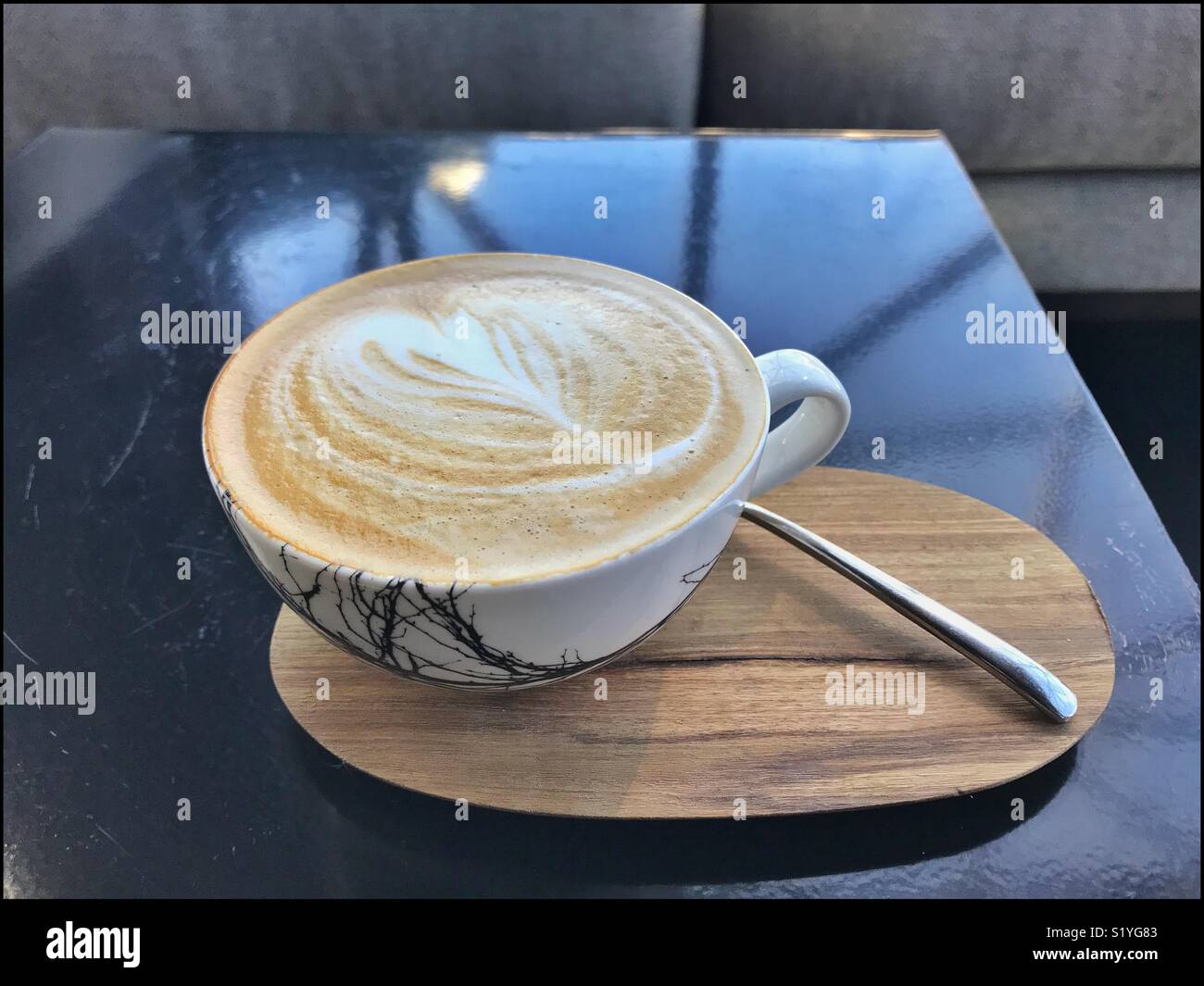 Cappuccino at the newly opened Zeitz MOCAA Food restaurant and bar in the Zeitz Museum, Cape Town, South Africa with its iconic bubble windows. - Smartphone Captured Stock Image