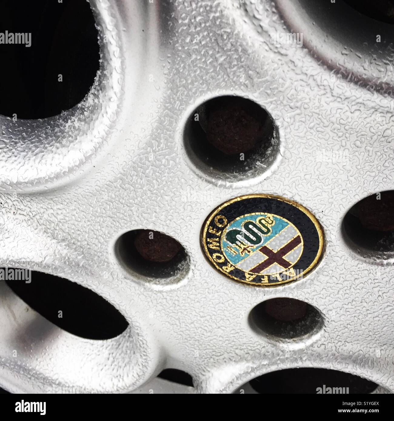 Ice covered Alfa Romeo wheel Stock Photo