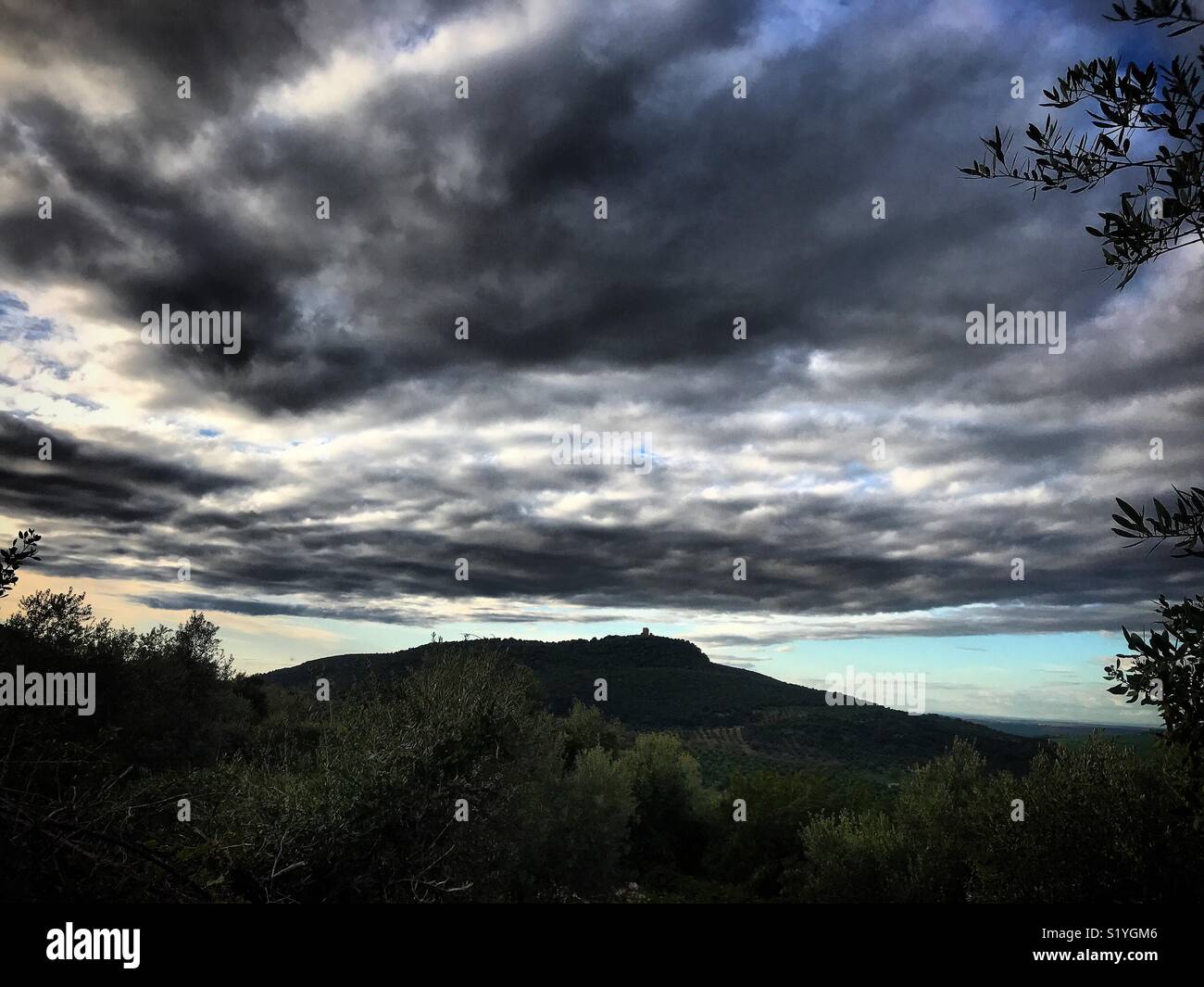 A storm gathering over Matrera Castle in Prado del Rey, Sierra de Cadiz, Andalusia, Spain - Smartphone Captured Stock Image