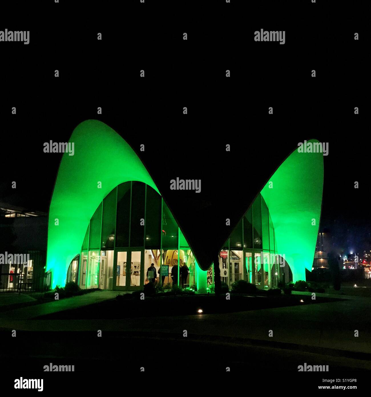 Neon museum arches glow green at night in Las Vegas Stock Photo