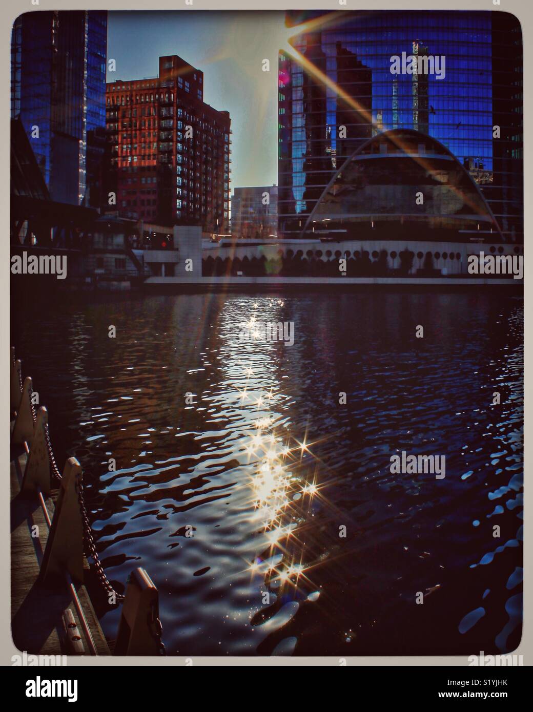 Sunbeams sparkle like stars onto the Chicago River. Stock Photo