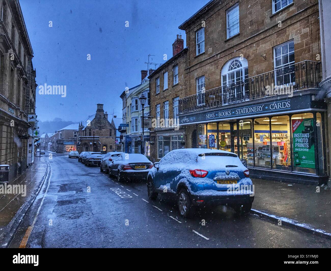 View down Cheap Street at dawn, with snow on the ground and a blizzard just starting, Beast from the East, Sherborne, Dorset, England, March 2018 - Smartphone Captured Stock Image