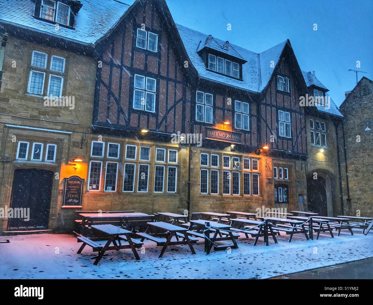 The Half Moon Inn, dawn, with snow on the ground and a blizzard just starting, Beast from the East, Sherborne, Dorset, England, March 2018 - Smartphone Captured Stock Image