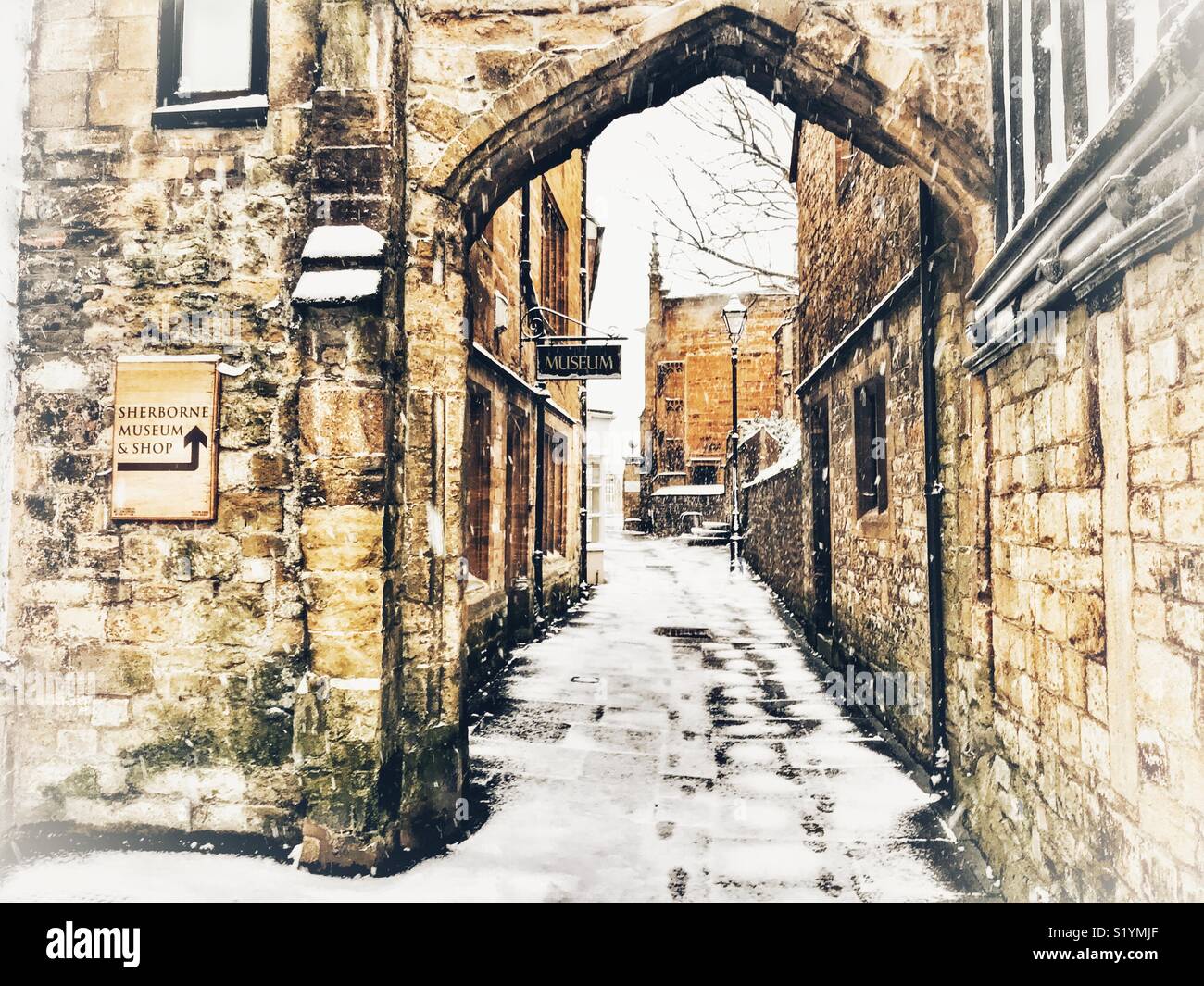 Church Lane, with snow on the ground and a blizzard just starting, Beast from the East, Sherborne, Dorset, England, March 2018 - Smartphone Captured Stock Image