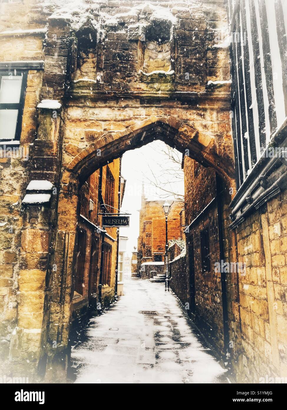Church Lane, with snow on the ground and a blizzard just starting, Beast from the East, Sherborne, Dorset, England, March 2018 - Smartphone Captured Stock Image