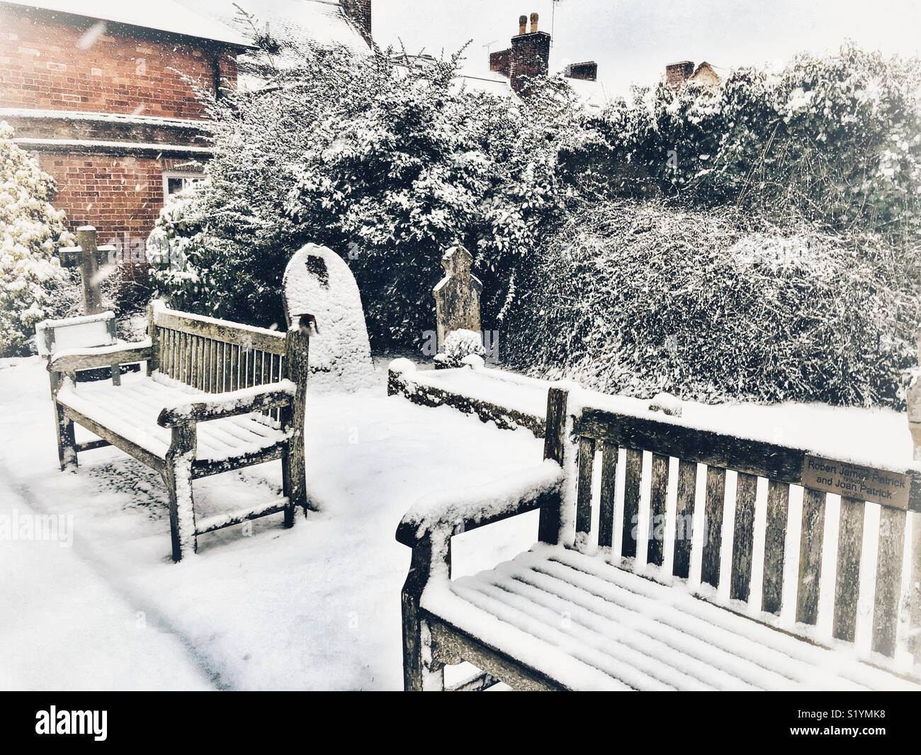 Methodist Church, Cheap Street, headstones and benches in the churchyard with snow during a blizzard, Beast from the East, Sherborne, Dorset, England, March 2018 - Smartphone Captured Stock Image