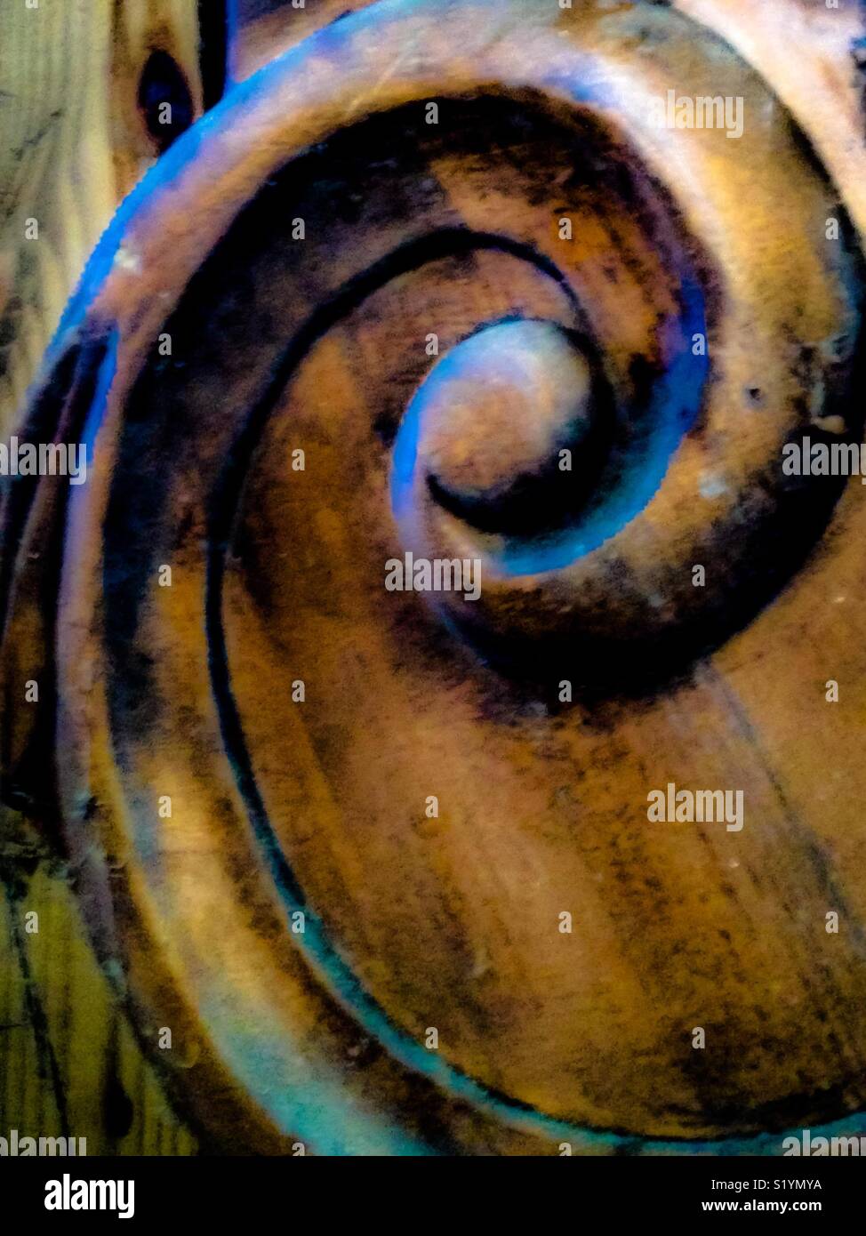 Scrolling up close on ornate footboard - Smartphone Captured Stock Image