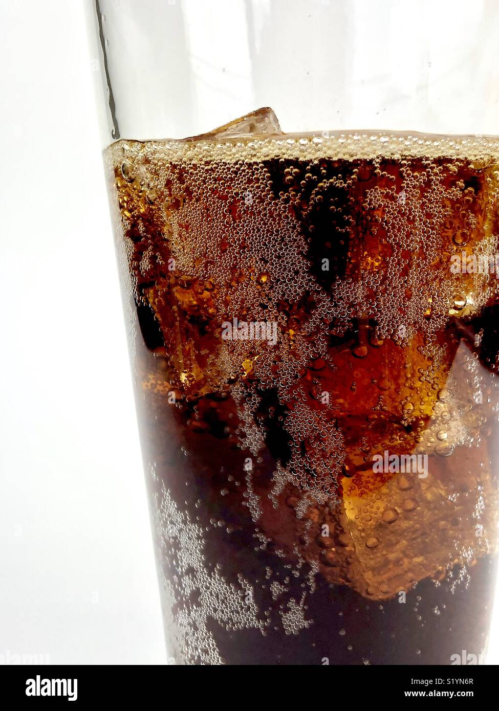Close up of a glass of cola over ice - Smartphone Captured Stock Image