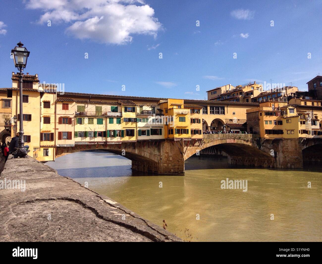 View across the Arno River to the Ponte Vecchio in Florence, Italy Stock Photo