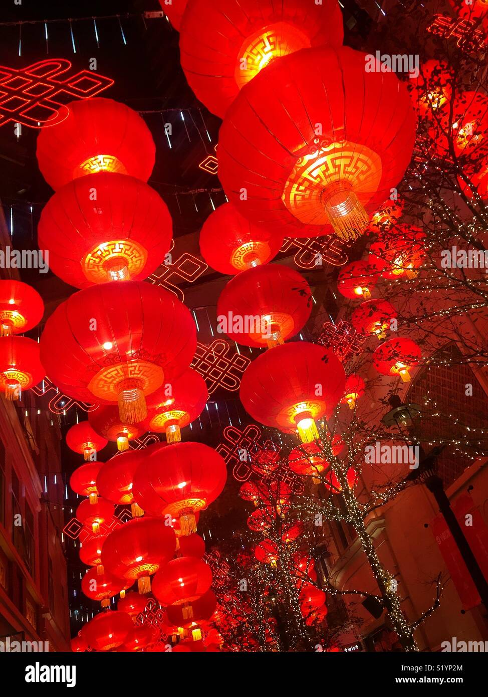 Red lanterns, traditional decorations for Chinese New Year, in Lee Tung Avenue, a shopping mall opened in 2015 on the site of old Lee Tung Street (‘Wedding Card Street’) in Wan Chai, Hong Kong - Smartphone Captured Stock Image