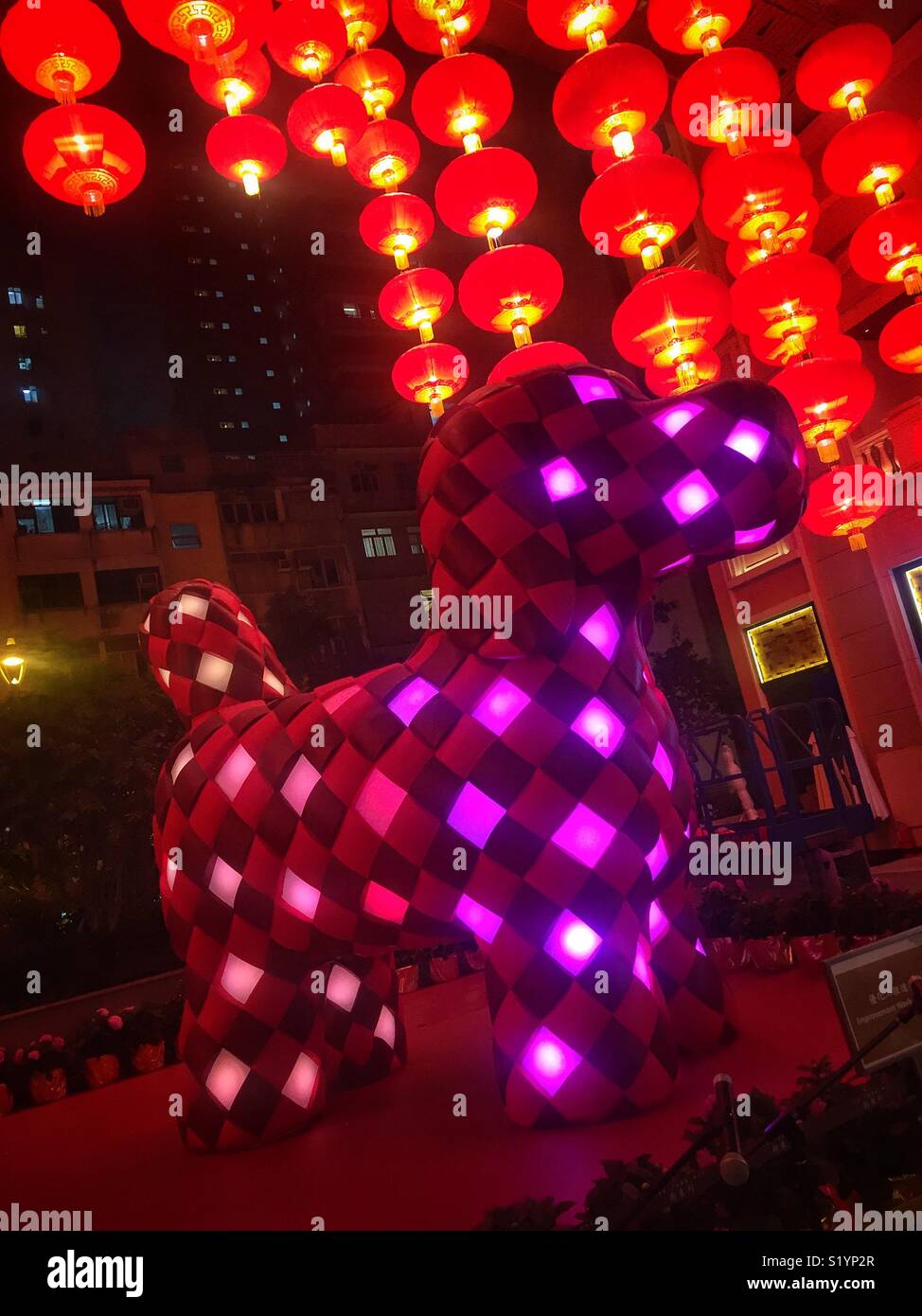 ‘Fortune Knot Doggie’, a 4-meter sculpture by Kavan Lau installed at Lee Tung Avenue, Wan Chai, Hong Kong Island for the Chinese New Year of the Dog in 2018, emulates traditional weaving technique Stock Photo
