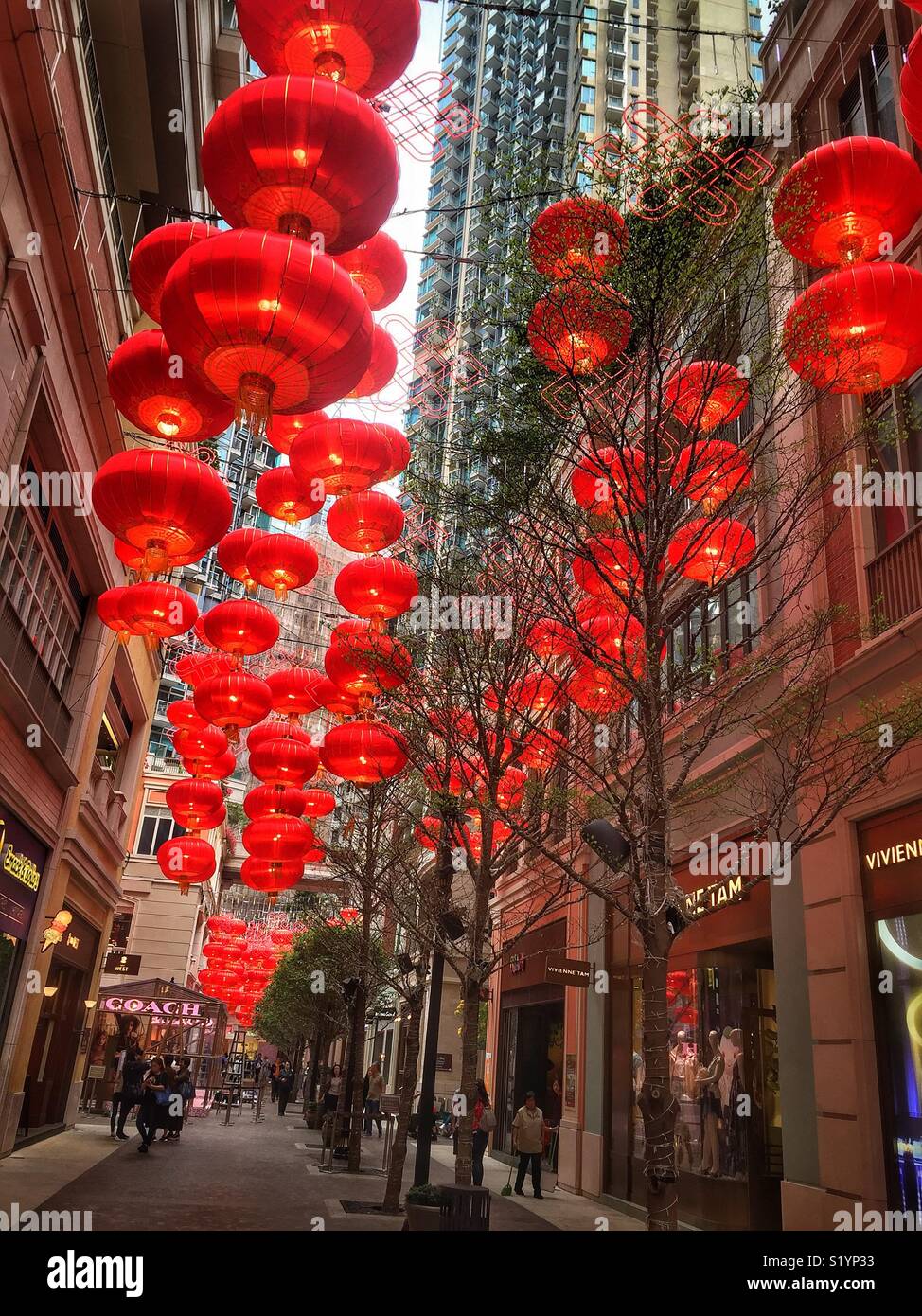 Red lanterns, traditional decorations for Chinese New Year, in Lee Tung Avenue, a shopping mall opened in 2015 on the site of old Lee Tung Street (‘Wedding Card Street’) in Wan Chai, Hong Kong - Smartphone Captured Stock Image