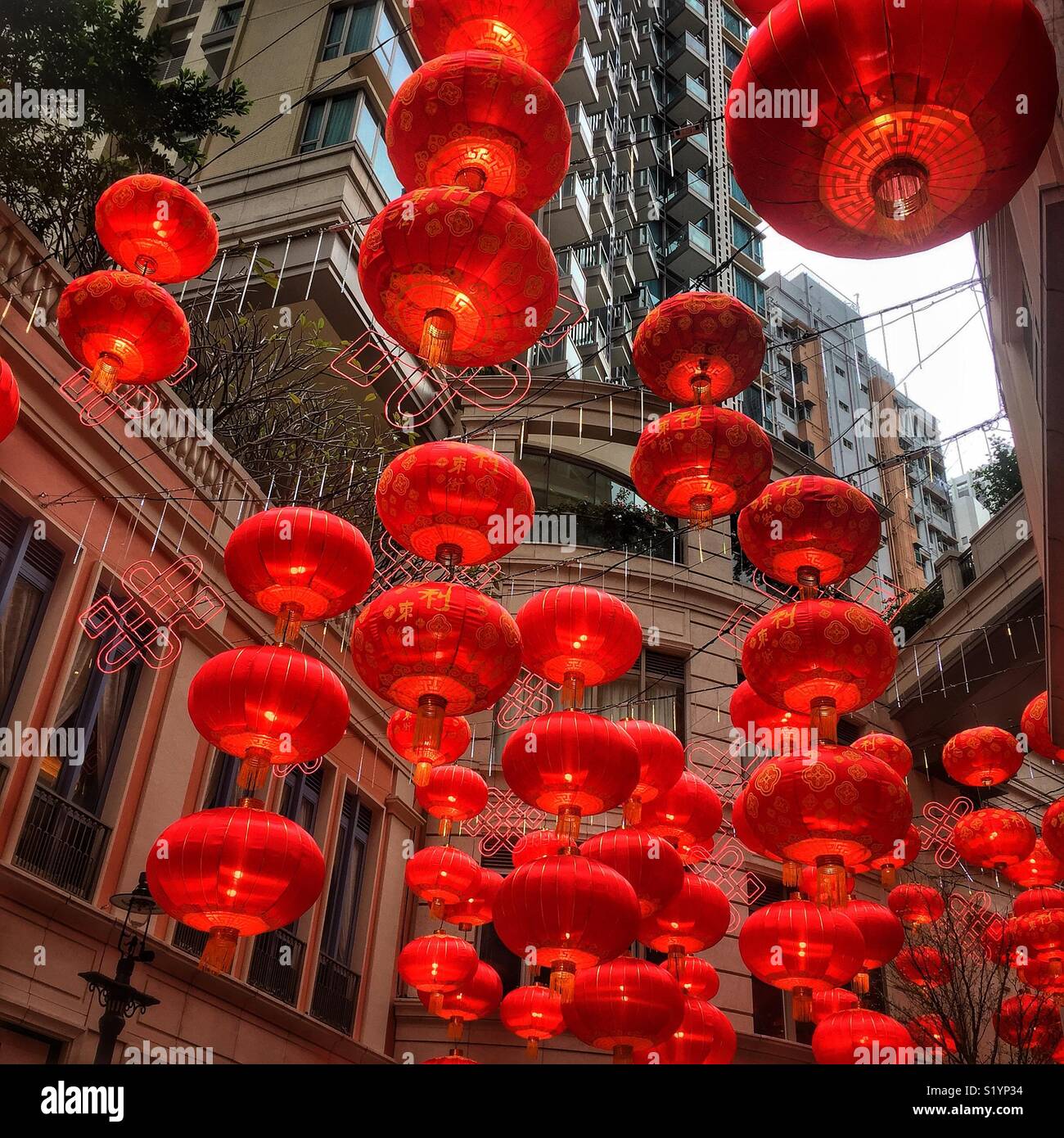 Red lanterns, traditional decorations for Chinese New Year, in Lee Tung Avenue, a shopping mall opened in 2015 on the site of old Lee Tung Street (‘Wedding Card Street’) in Wan Chai, Hong Kong - Smartphone Captured Stock Image