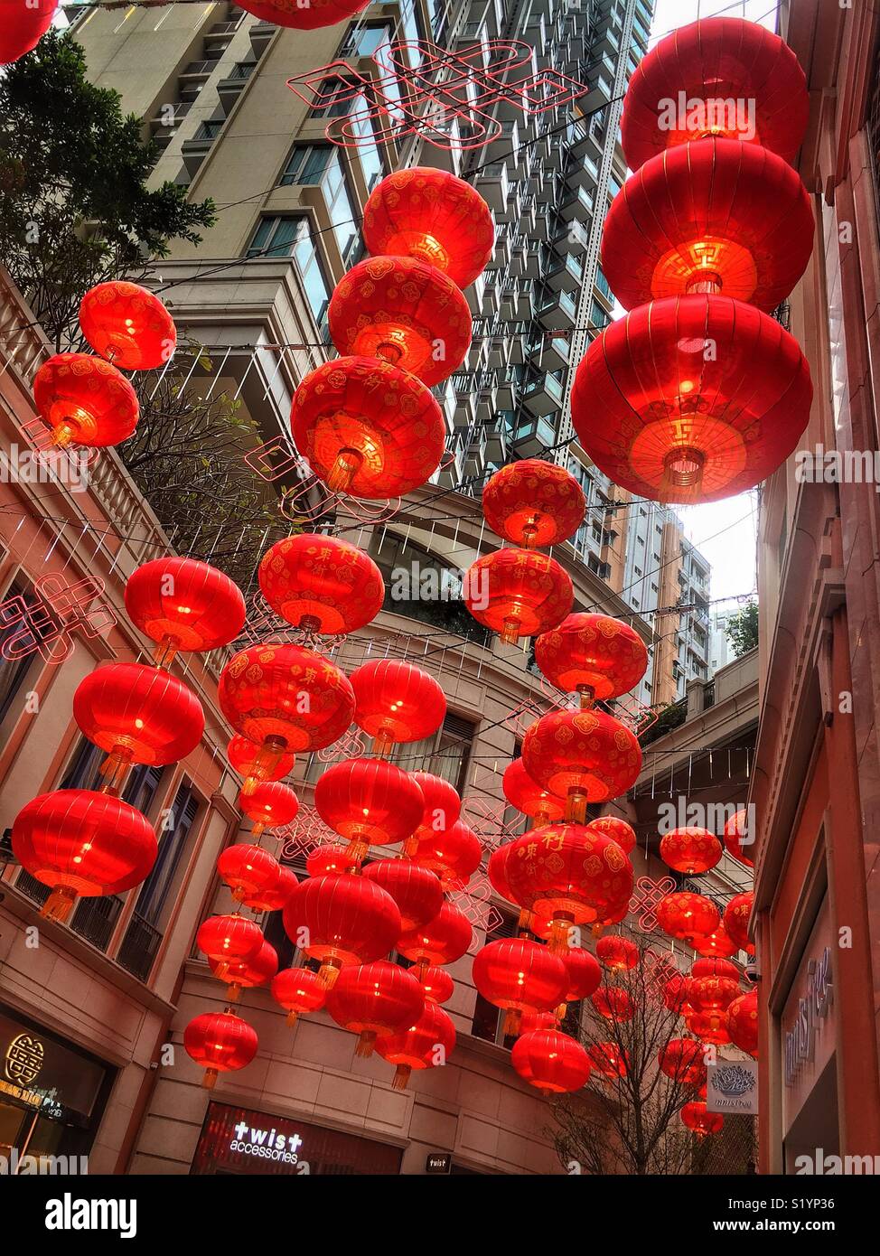 Red lanterns, traditional decorations for Chinese New Year, in Lee Tung Avenue, a shopping mall opened in 2015 on the site of old Lee Tung Street (‘Wedding Card Street’) in Wan Chai, Hong Kong - Smartphone Captured Stock Image