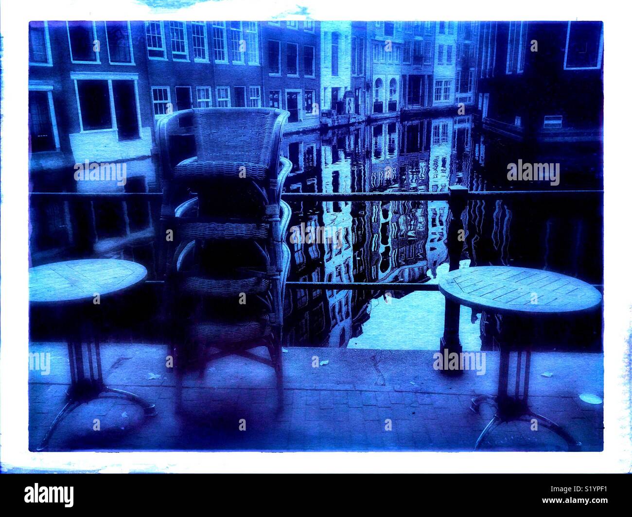 Blue tint if cafe by canal, Amsterdam, Netherlands - Smartphone Captured Stock Image