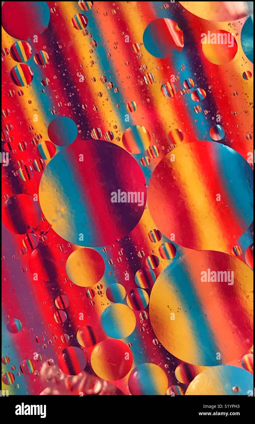 An artistic picture of lines, stripes and circles, with the odd bubble included. Predominant colours are yellow, blue orange, red and violet. Photo Credit - © COLIN HOSKINS. - Smartphone Captured Stock Image