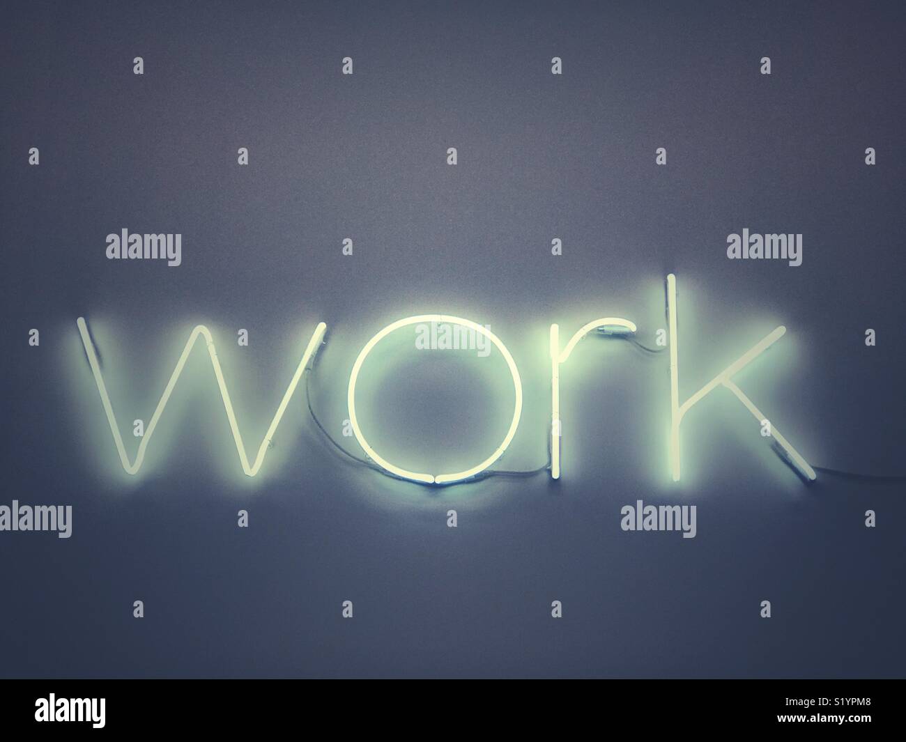 A neon sign saying work - Smartphone Captured Stock Image
