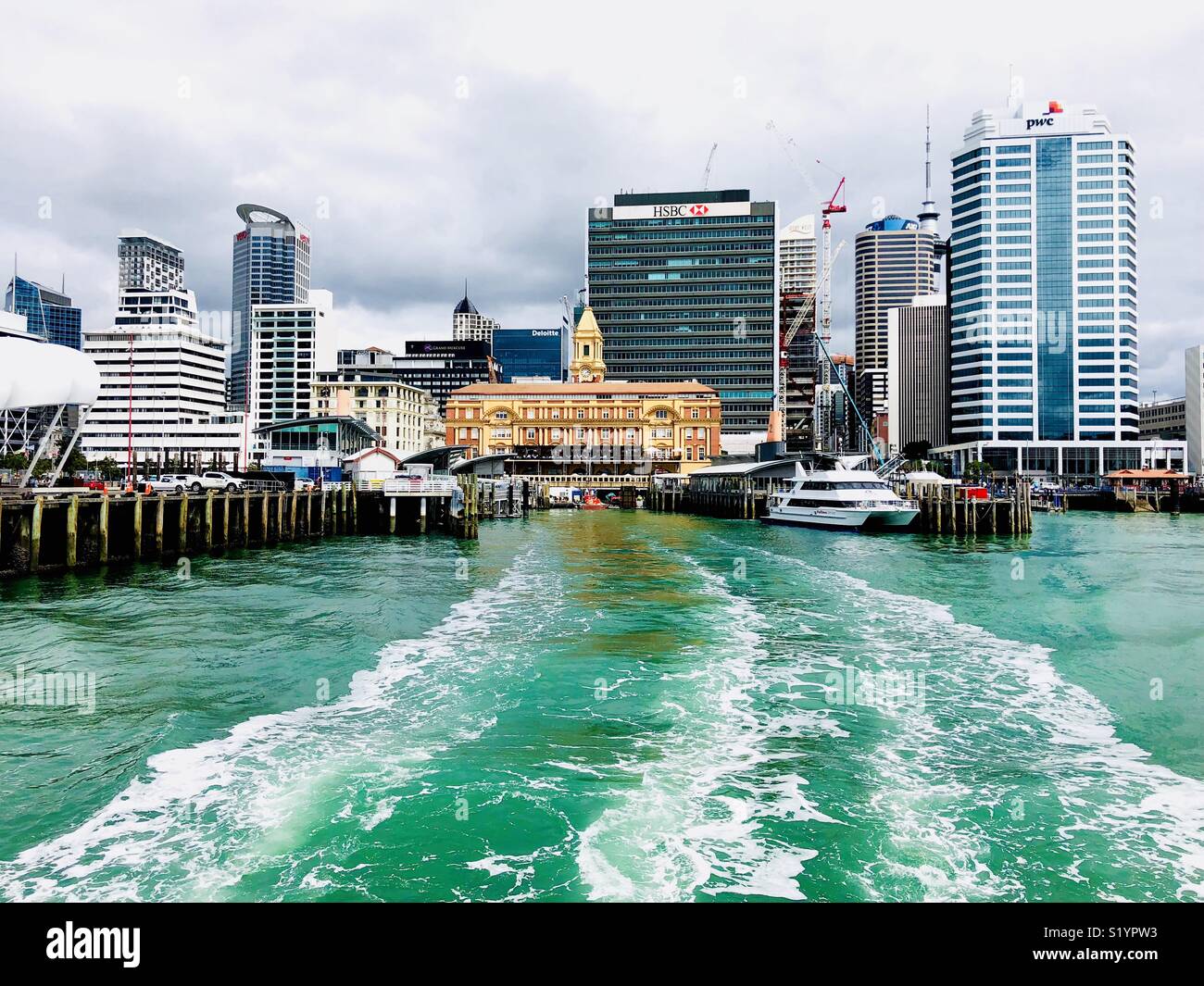 View at Auckland Harbour with Old Ferry Building from the Water - Smartphone Captured Stock Image