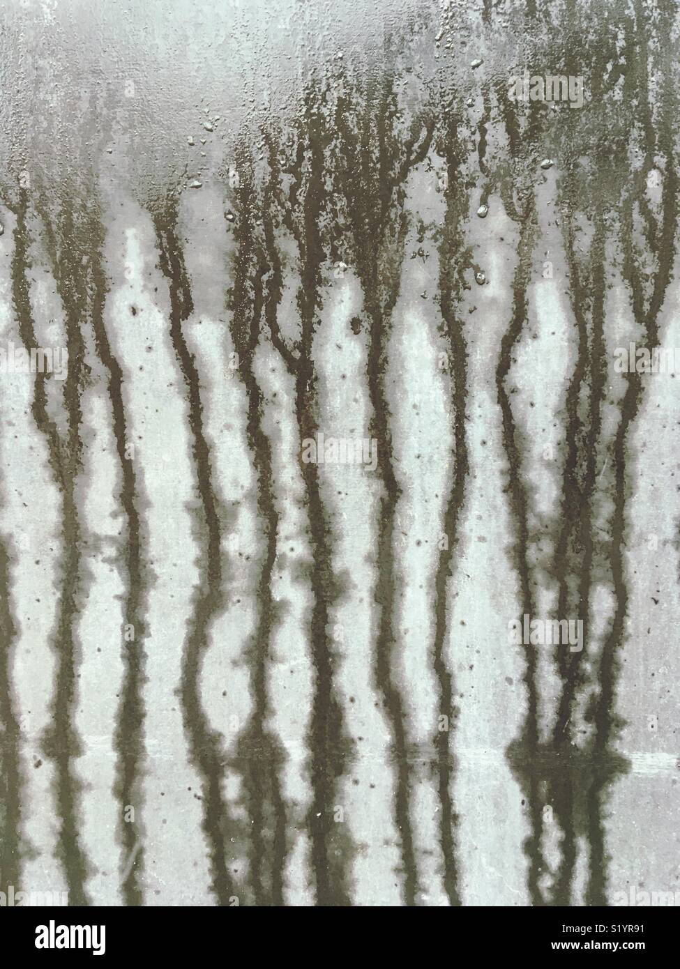 Water running down a concrete wall - Smartphone Captured Stock Image