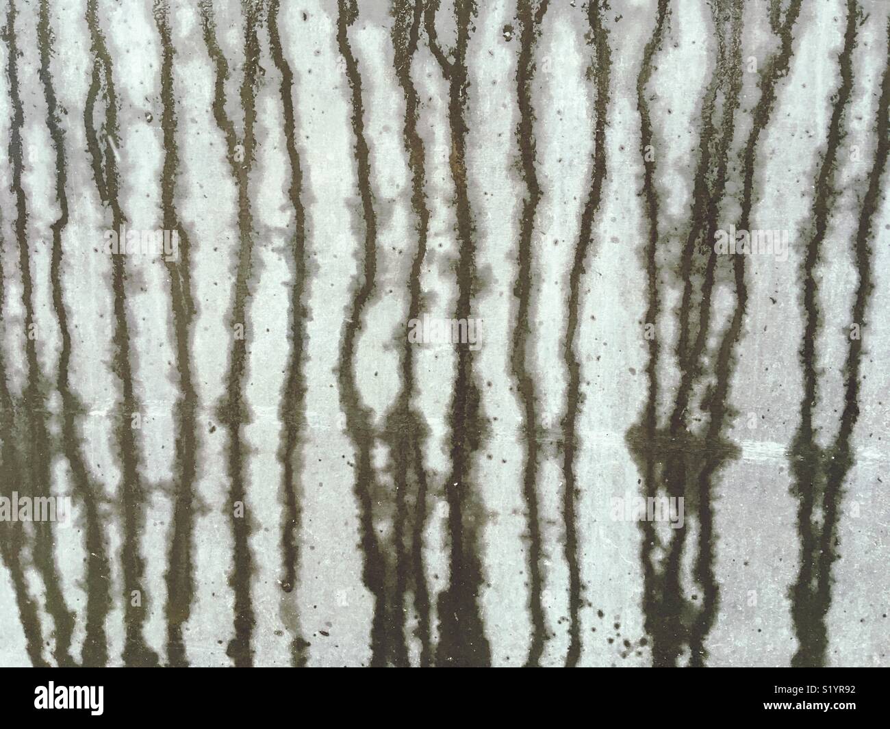 Water running down a concrete wall - Smartphone Captured Stock Image