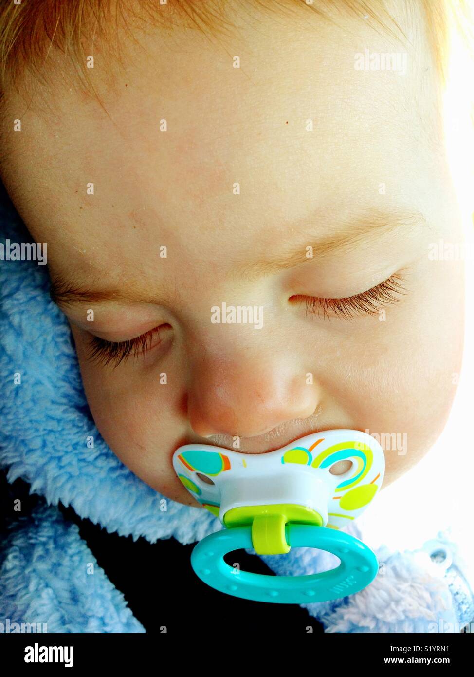 Sleeping baby with pacifier Stock Photo Alamy