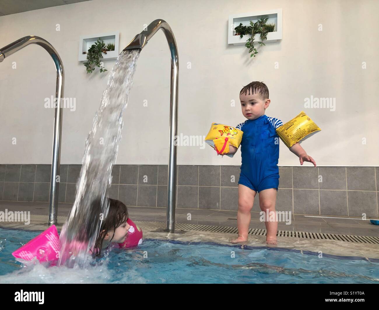 Toddler in swimming pool Stock Photo Alamy