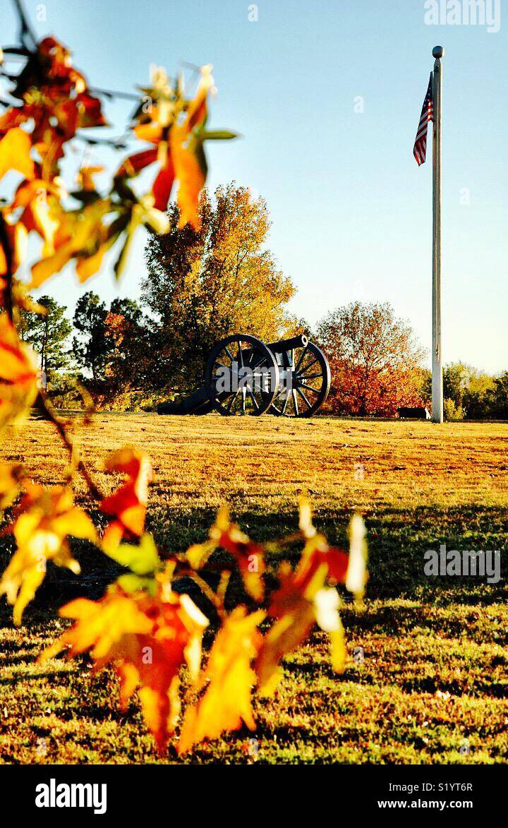 A cannon sits sentry at the location of the first Fort Smith on the Arkansas River. The foundations are all that are left of the first fort. - Smartphone Captured Stock Image
