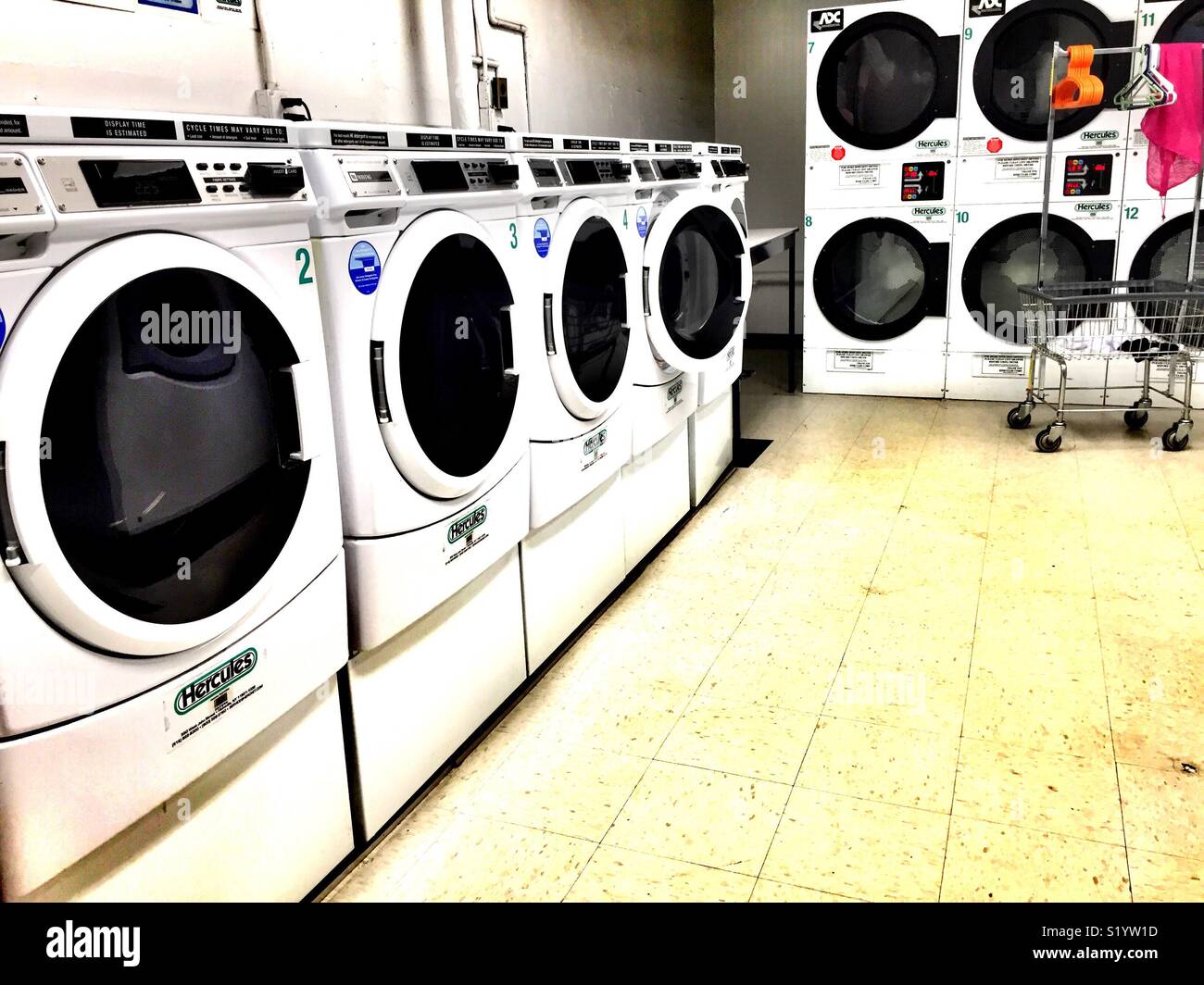 Front loading washers and dryer's in commercial laundromat, United States  Stock Photo - Alamy