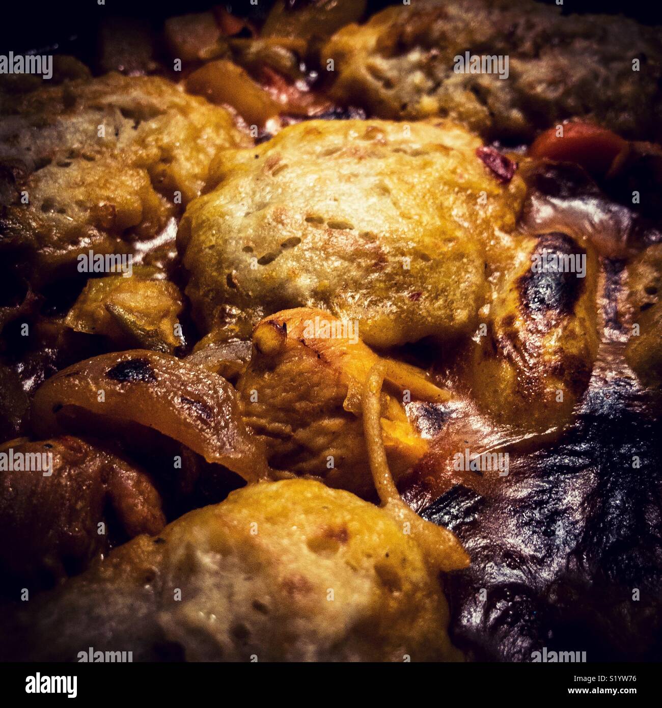 A hearty chicken stew with dumplings in the pot Stock Photo