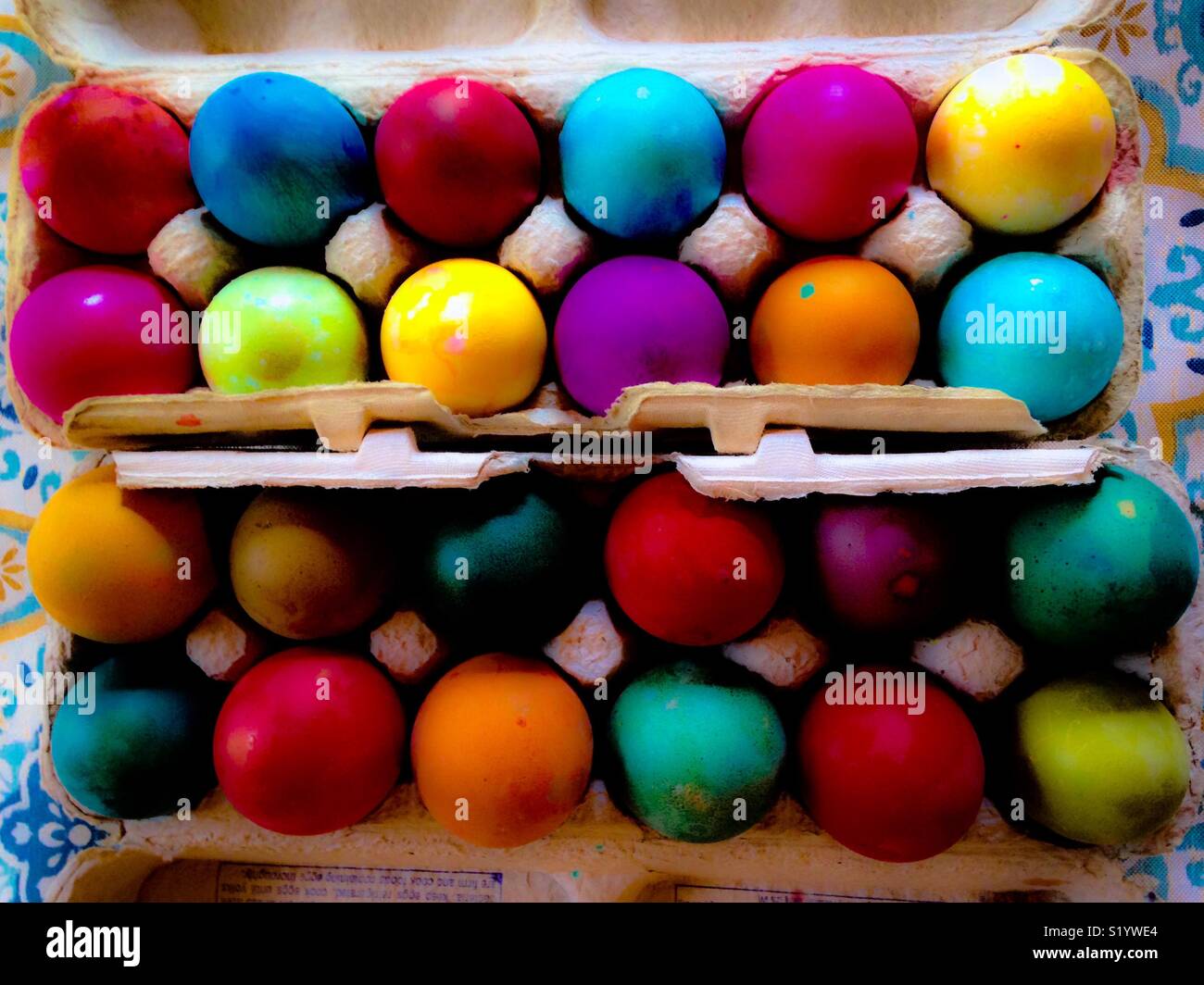 Vivid Easter eggs in egg cartons as viewed from top down - Smartphone Captured Stock Image