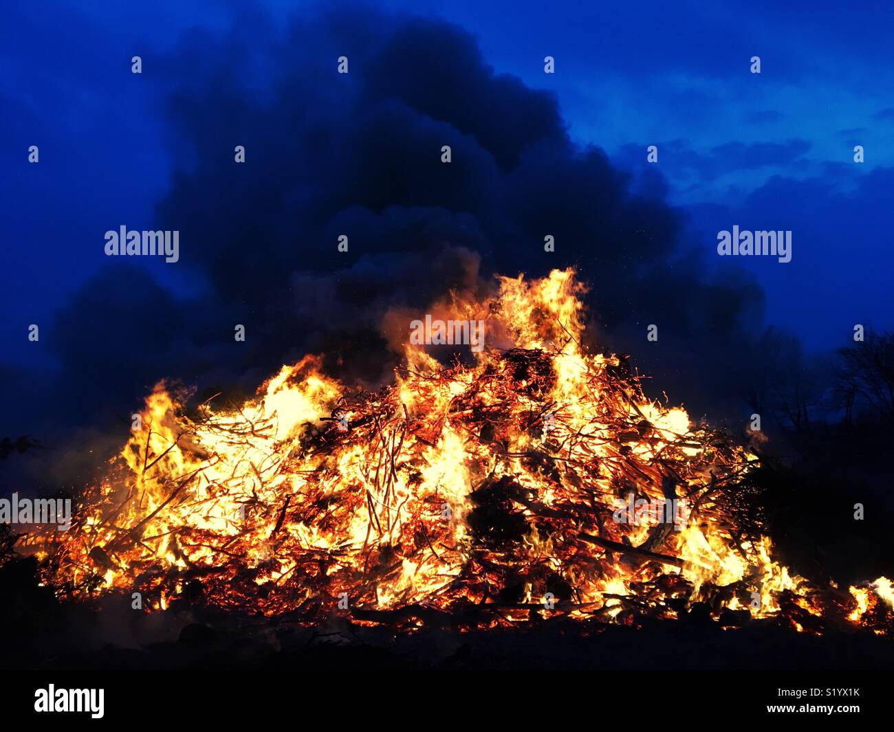 A bonfire in the blue hour at dusk - Smartphone Captured Stock Image