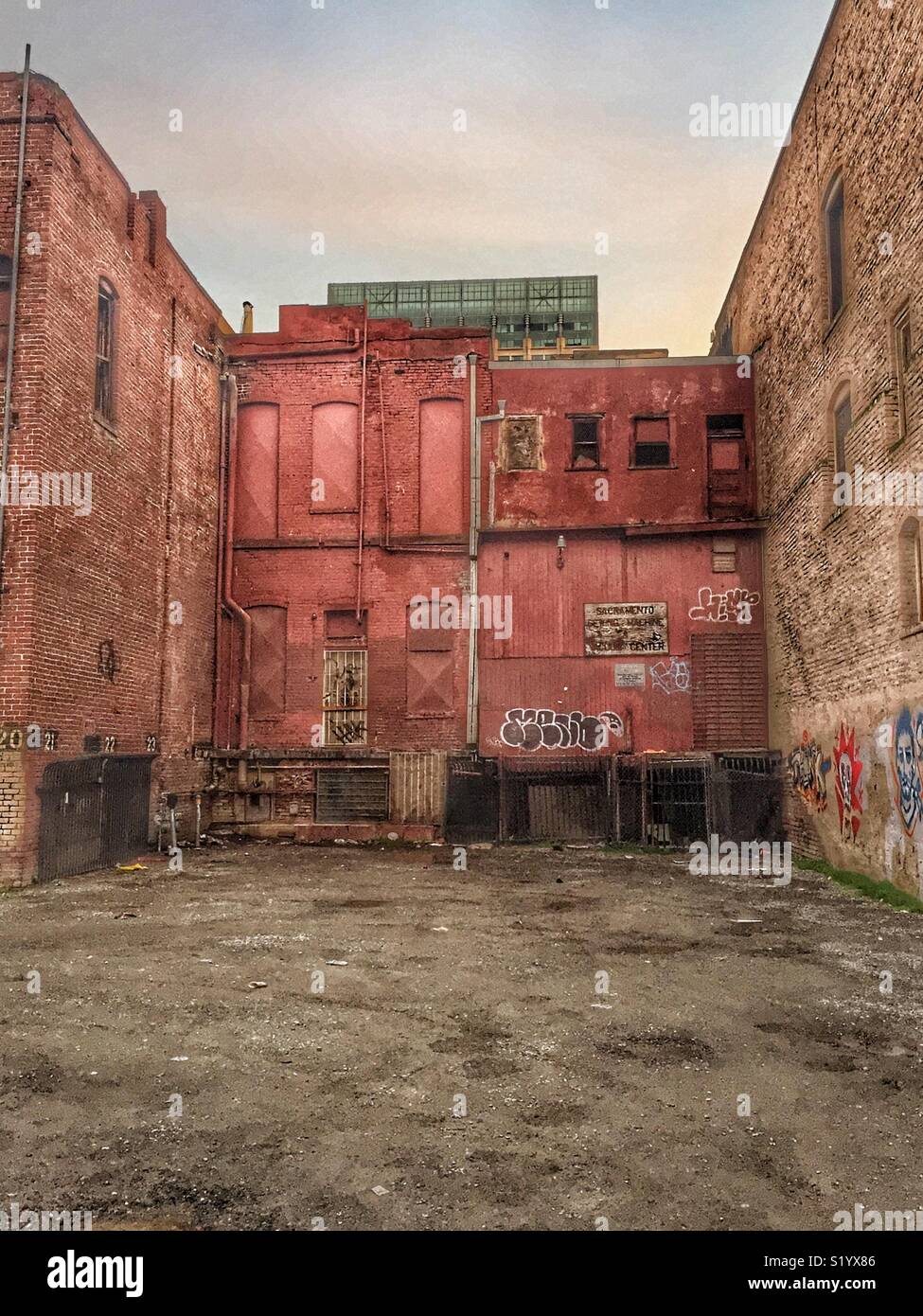 Back building with graffiti in the ghetto part of town Stock Photo Alamy