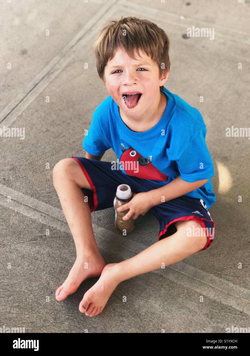 Little boy sticking tongue out Stock Photo
