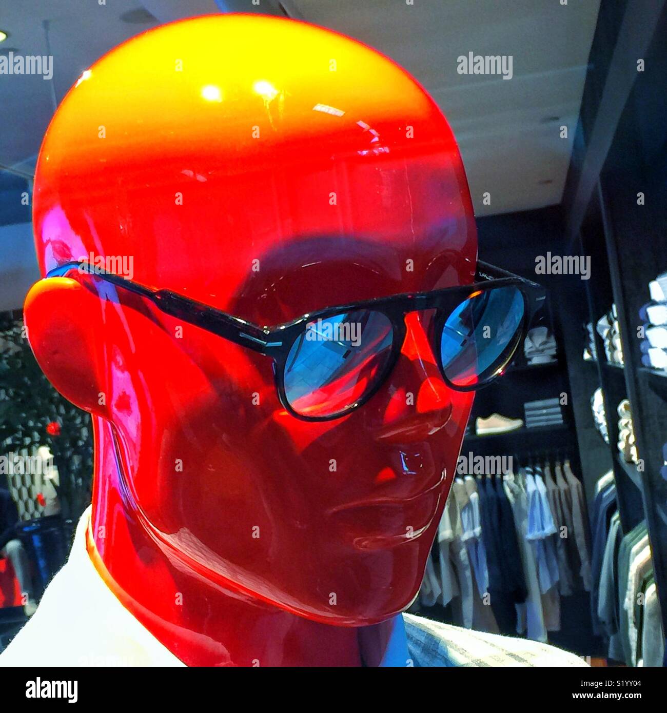 Red head manikin in sunglasses - Smartphone Captured Stock Image