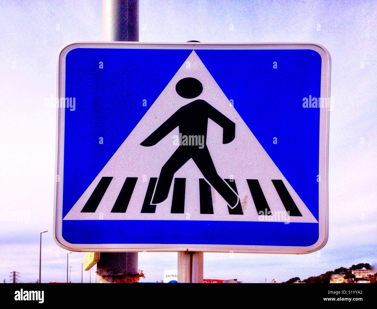 A road sign warning of a pedestrian crossing. - Smartphone Captured Stock Image