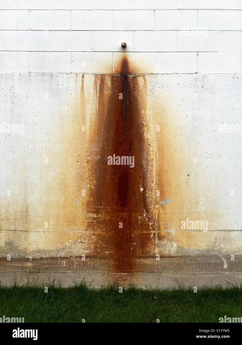 Drainage spout and rust stain. - Smartphone Captured Stock Image