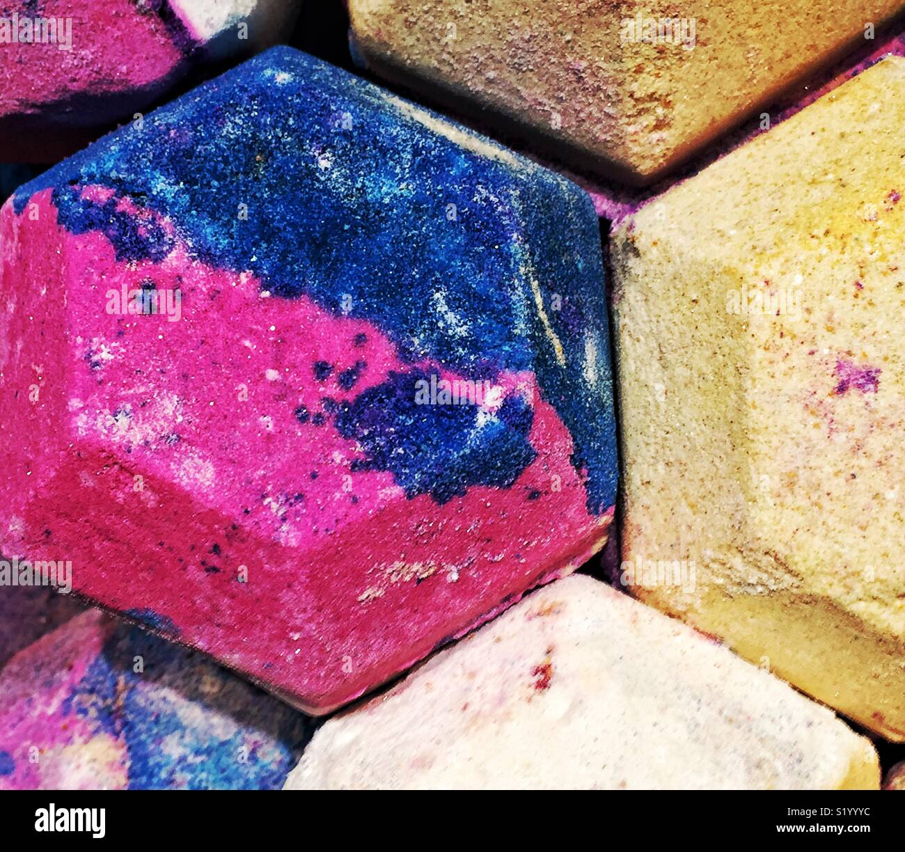 Colorful magenta and blue hexagonal modern bath bombs - Smartphone Captured Stock Image