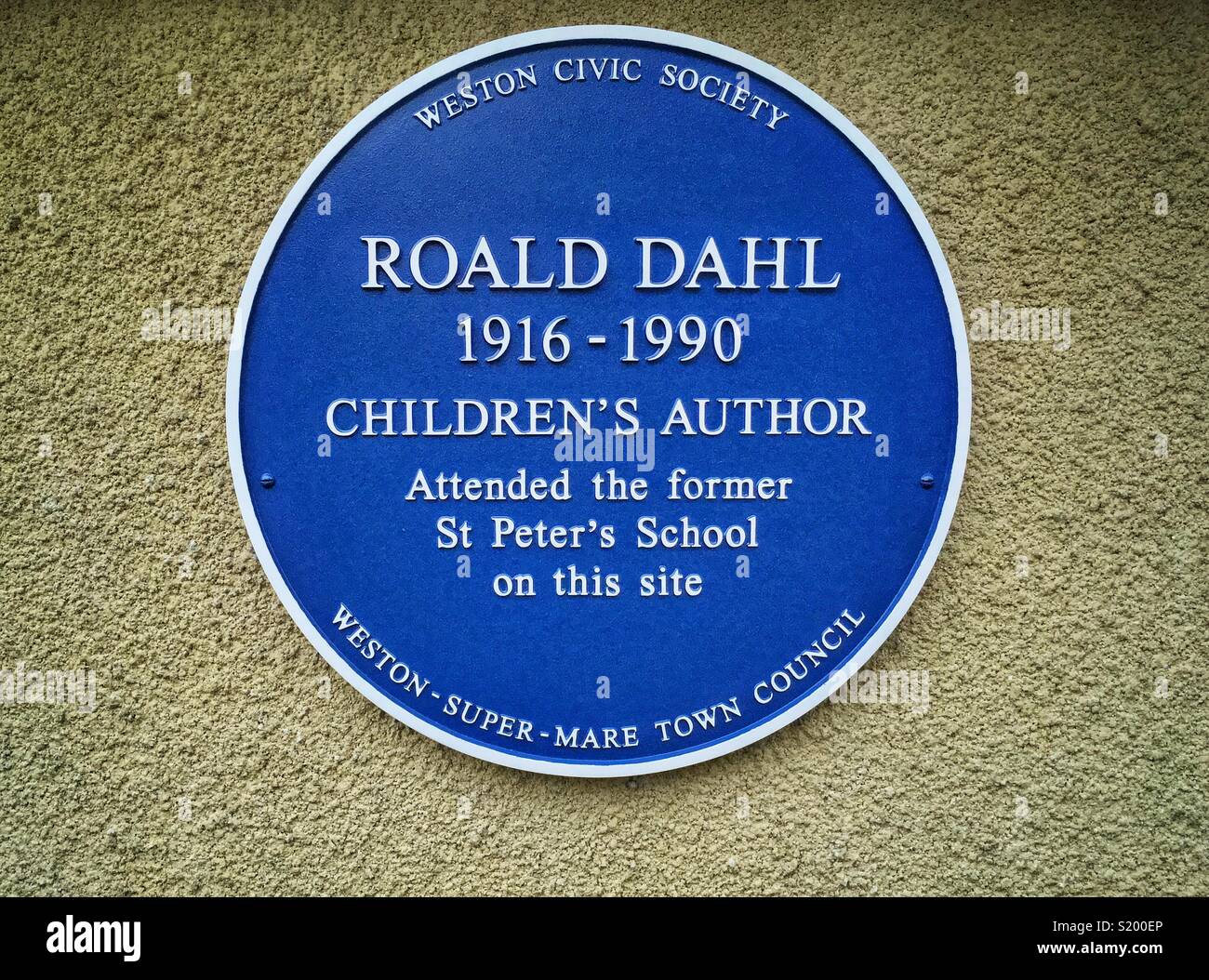 A recently-installed blue plaque commemorating author Roald Dahl’s time at St Peter’s School in Weston-super-Mare, UK - Smartphone Captured Stock Image