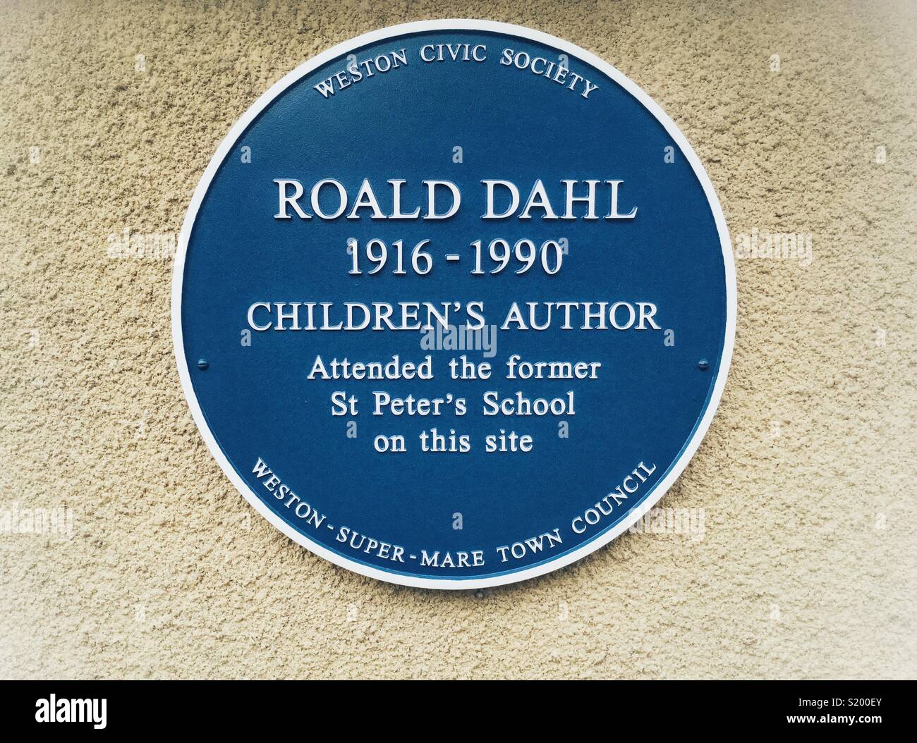 A recently-installed blue plaque commemorating author Roald Dahl’s time at St Peter’s School in Weston-super-Mare, UK - Smartphone Captured Stock Image
