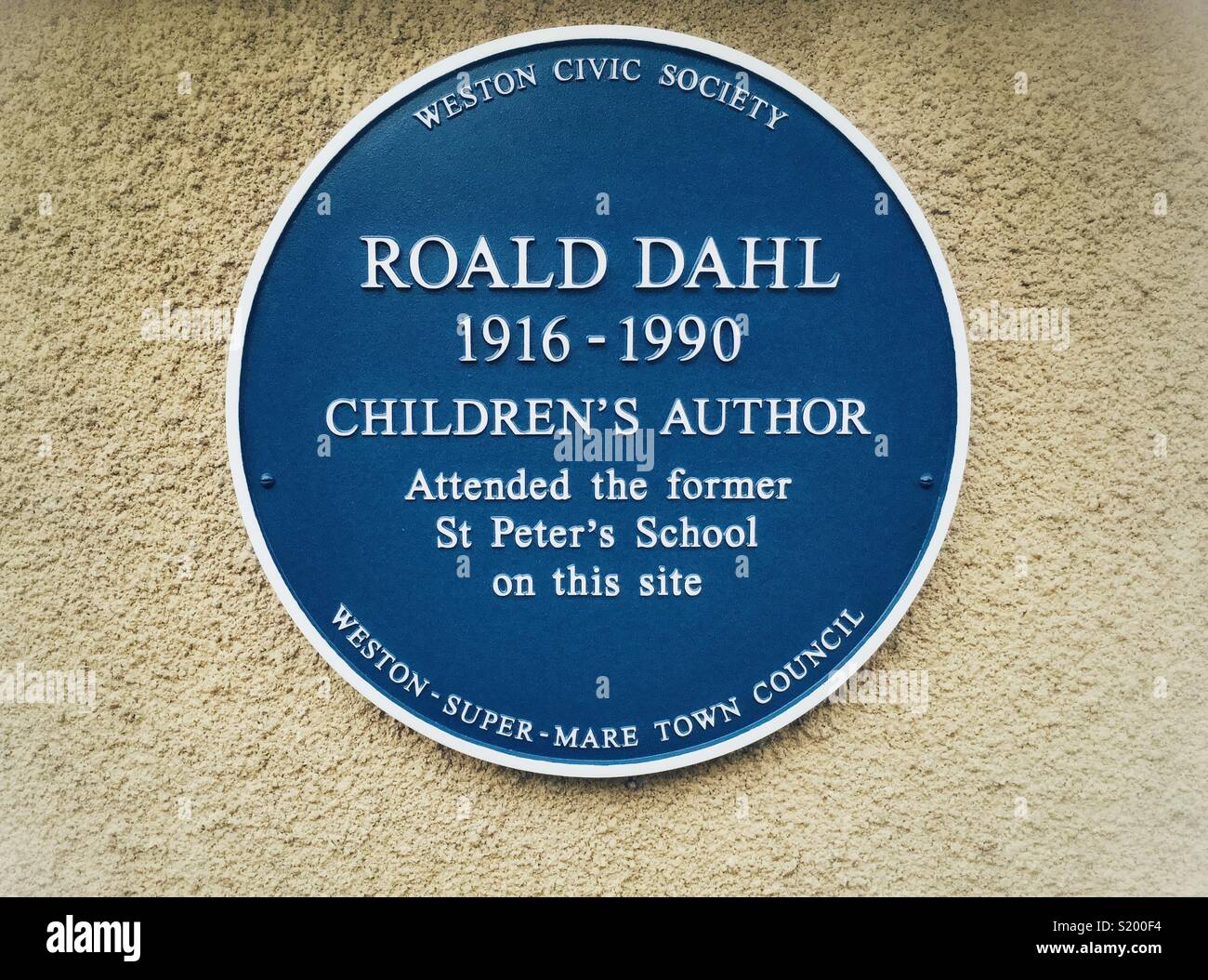 A recently-installed blue plaque commemorating author Roald Dahl’s time at St Peter’s School in Weston-super-Mare, UK - Smartphone Captured Stock Image
