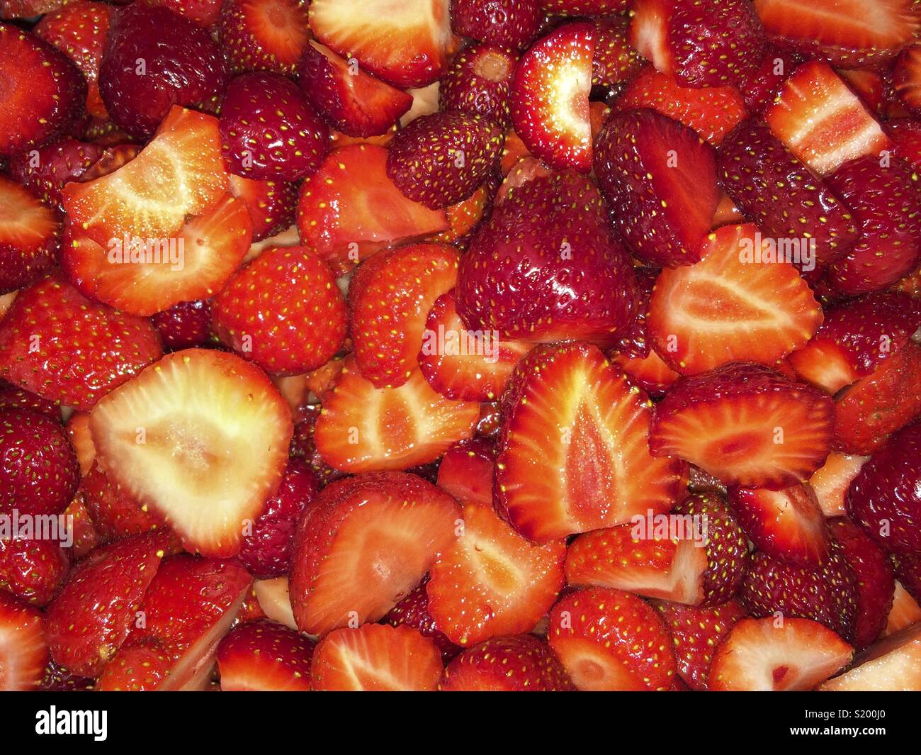 Detail closeup background of red fresh strawberrys prepered to cook marmalade Stock Photo