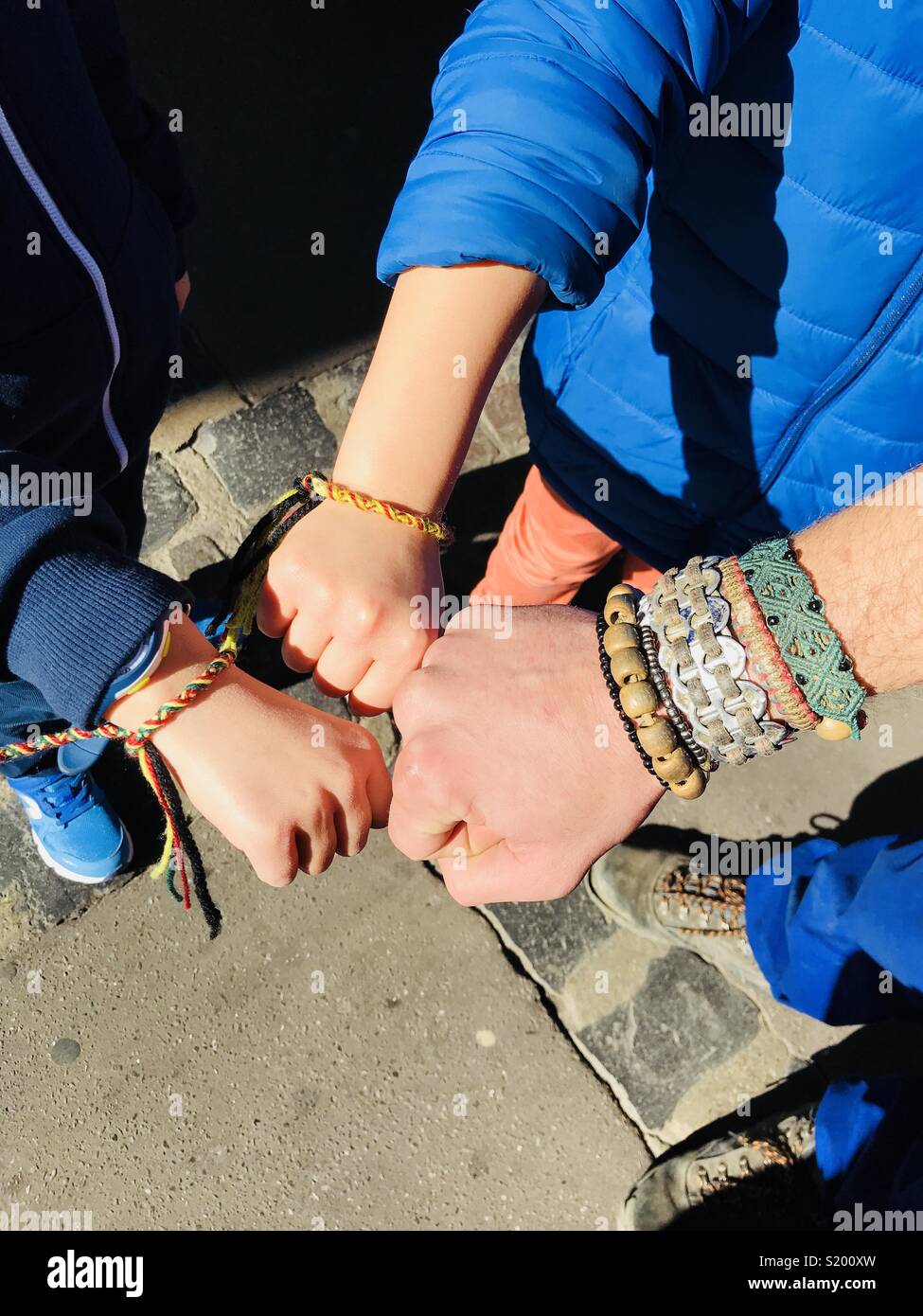 Bracelet exchange between 2 kids and à street books vendeur at Montpellier,  France Stock Photo - Alamy