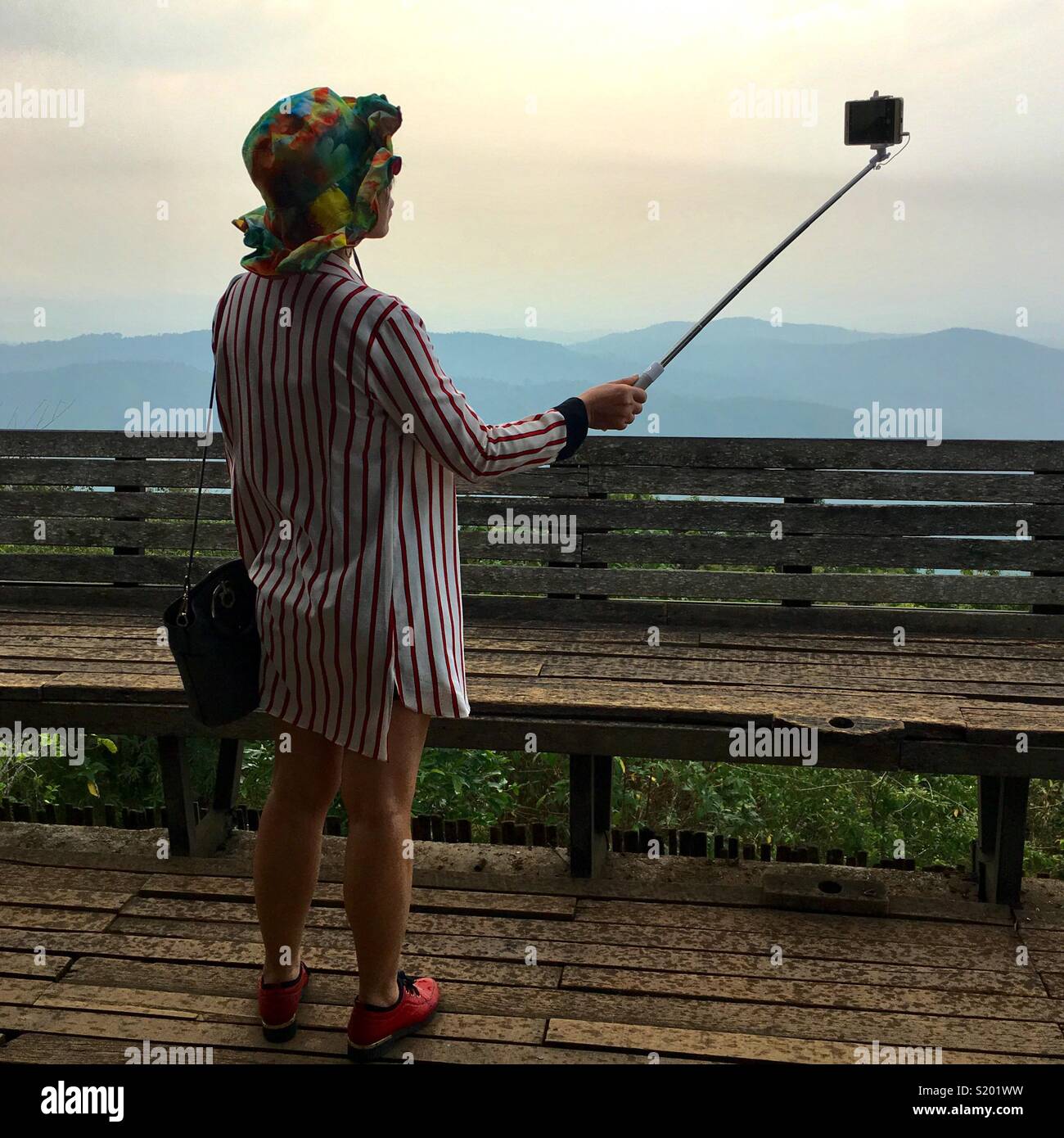 Tourist taking selfies - Smartphone Captured Stock Image