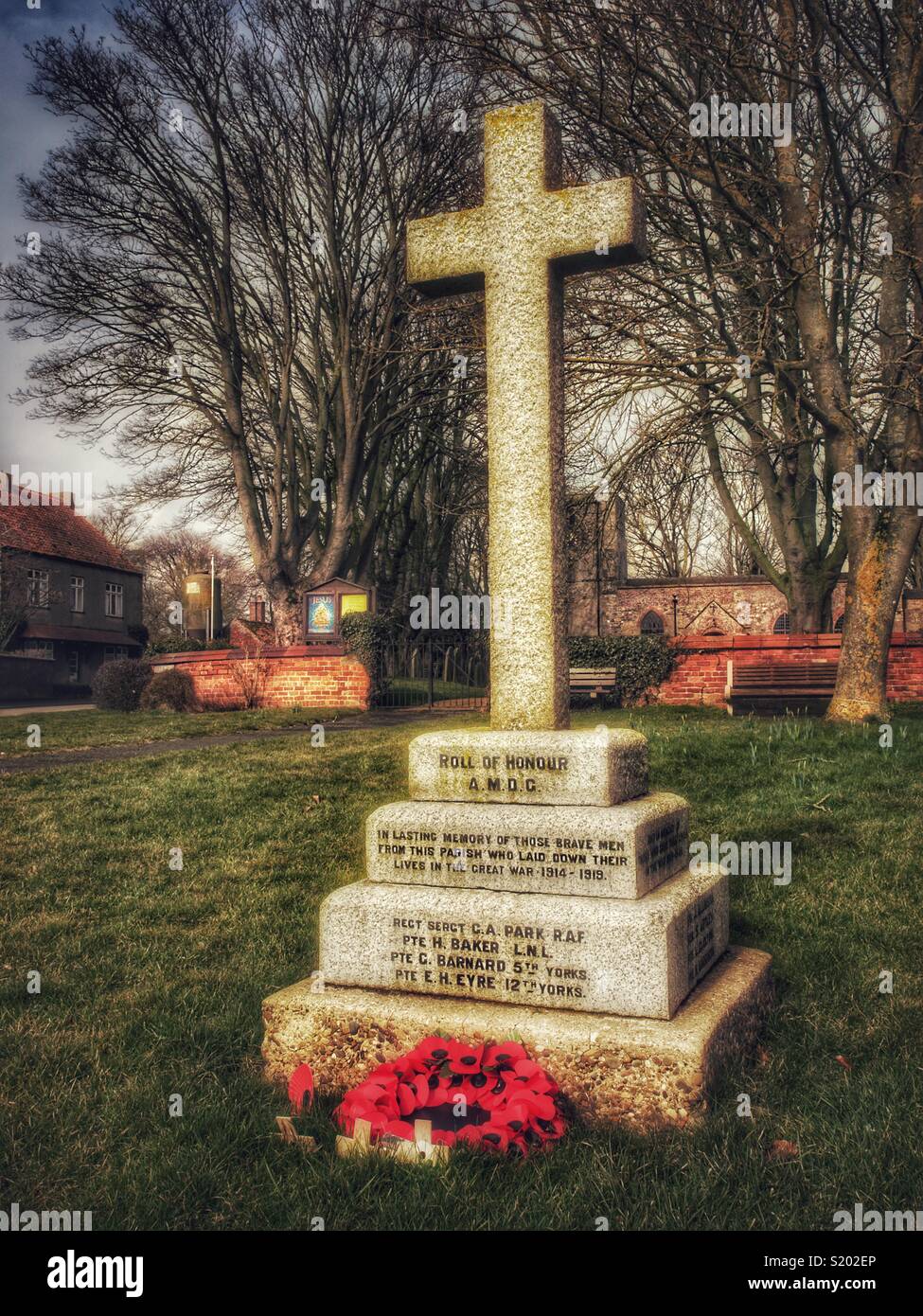 War memorial outside village parish church, Yorkshire Dales, England, UK - Smartphone Captured Stock Image