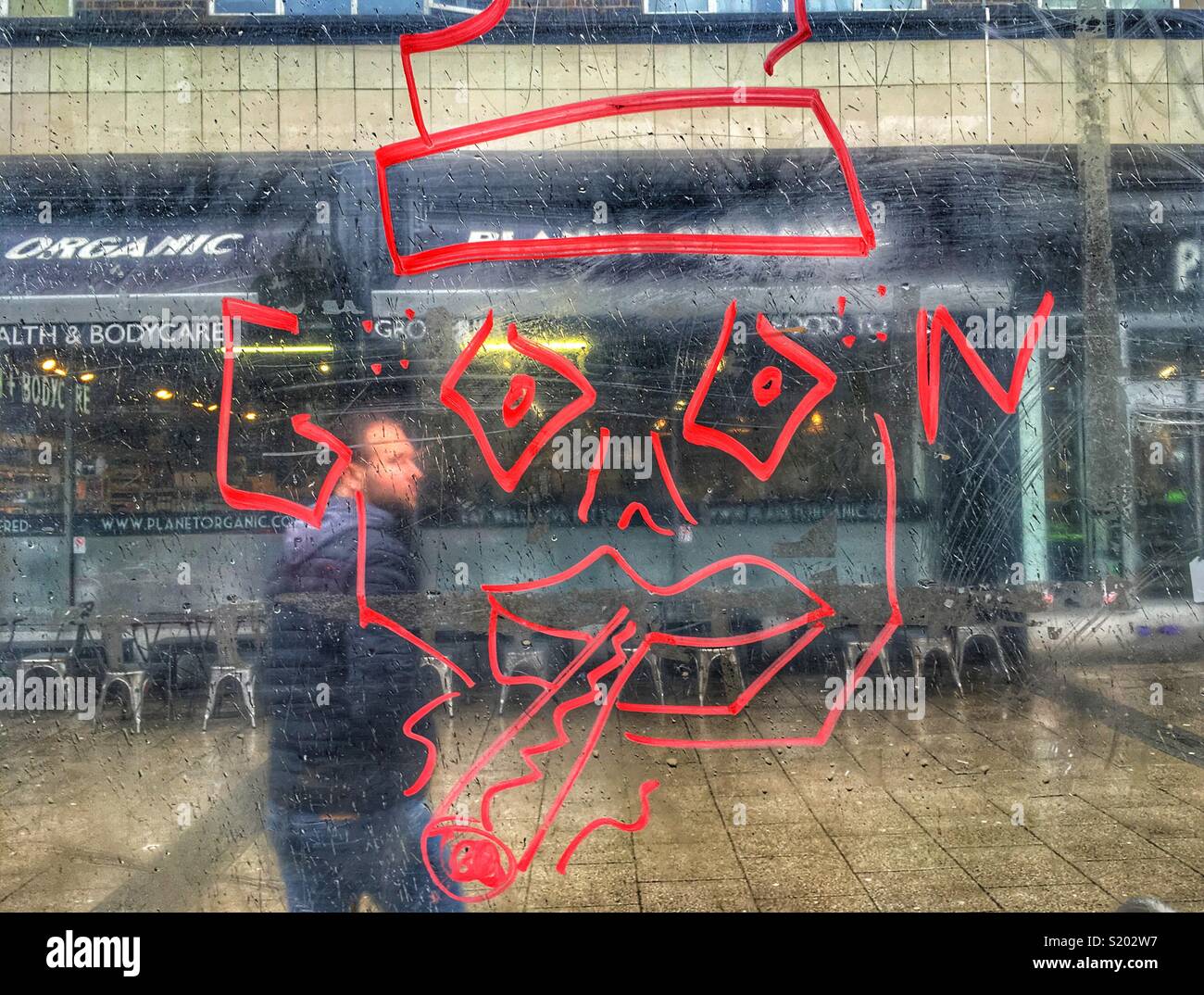 Planet Organic, bus stop graffiti in Muswell Hill in London, England - Smartphone Captured Stock Image