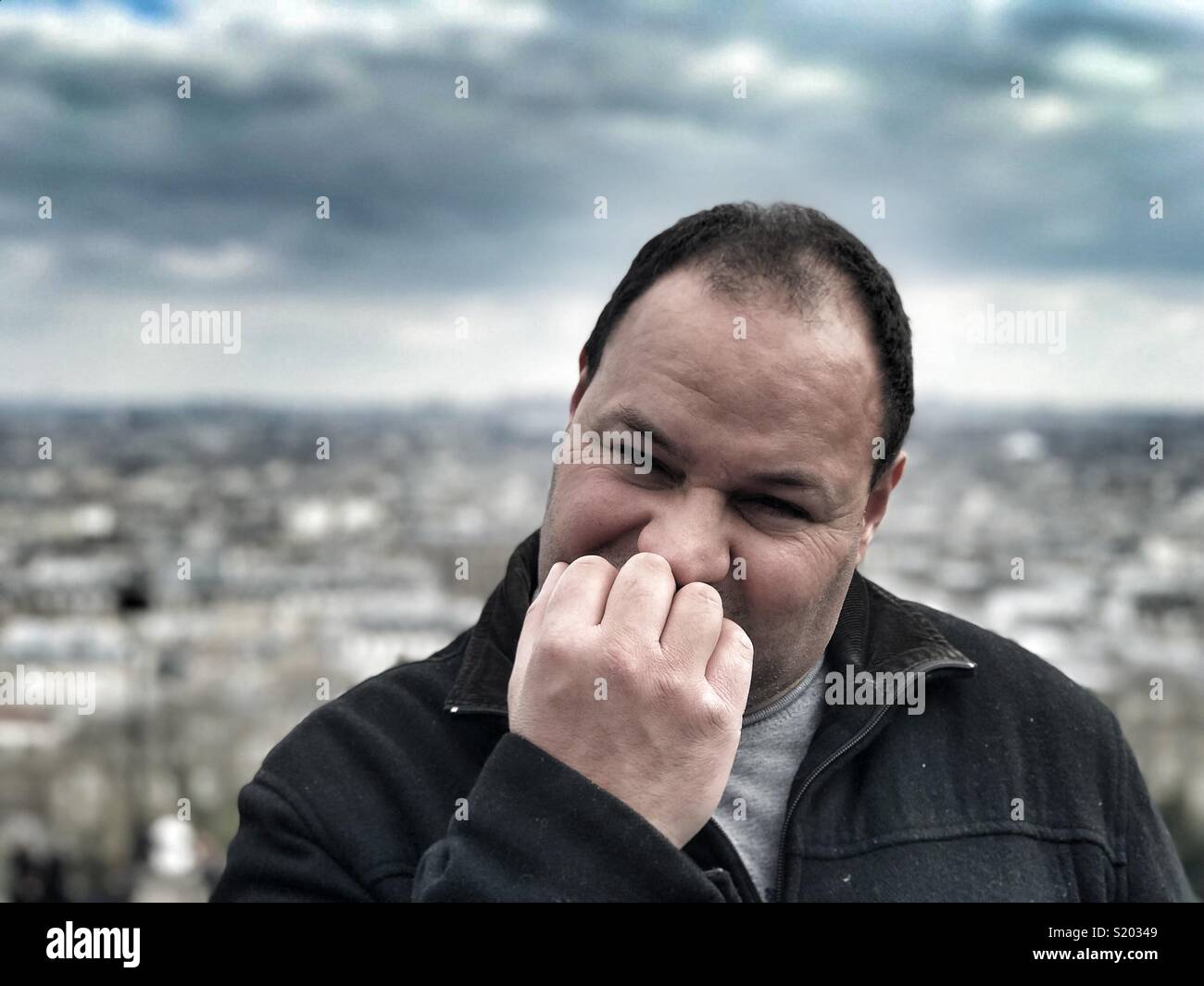 Stressed man in big city Paris France - Smartphone Captured Stock Image