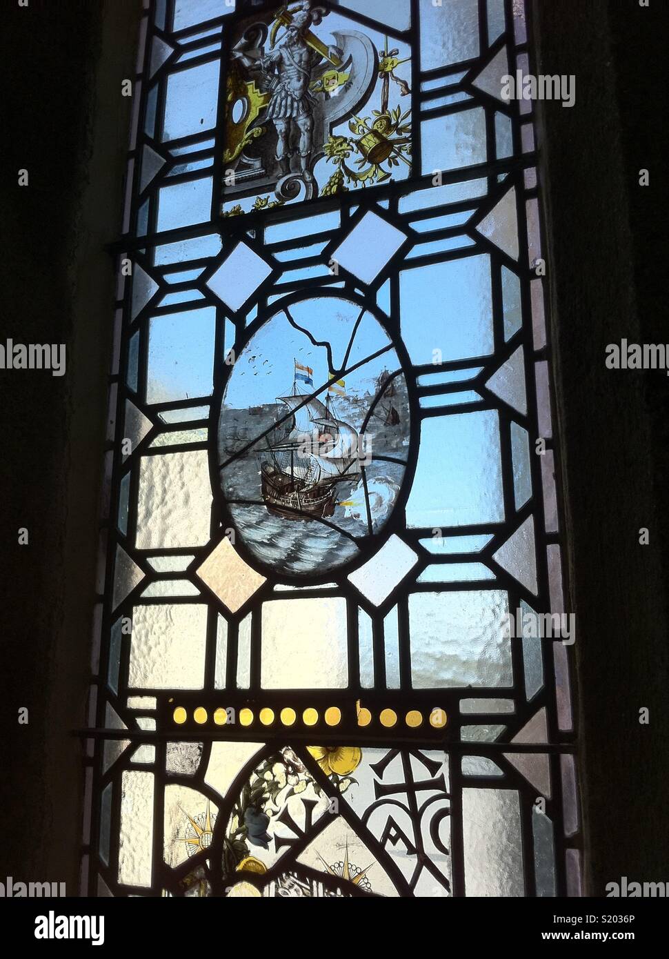 Stained glass window depicting a sailing ship and warrior, Saint